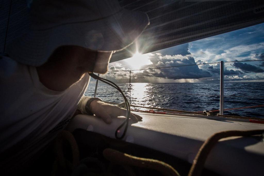 October 22, 2014. Leg 1onboard Team Vestas Wind. Always keeping an eye out for the changing conditions. Volvo Ocean Race photo copyright Brian Carlin - Team Vestas Wind taken at  and featuring the  class