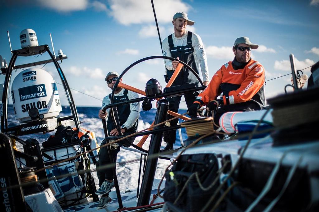 October 26, 2014. Leg 1 onboard Team Vestas Wind.Tony Rae, Maciel Cicchetti, aka Cicho and Nicolai Sehested on watch. Young guns and old guns sporting a new look. Day 15 at Sea.. © Brian Carlin - Team Vestas Wind