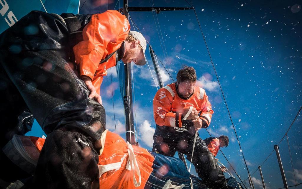 October 26, 2014. Leg 1 onboard Team Vestas Wind. Tony Rae helps Nicolai Sehested with the Fractional Zero on the bow. Day 15 at Sea. Volvo Ocean Race. photo copyright Brian Carlin - Team Vestas Wind taken at  and featuring the  class