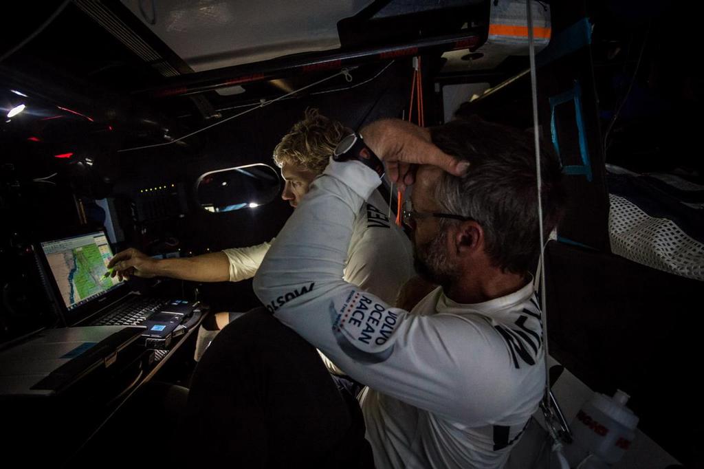 October 26, 2014. Leg 1 onboard Team Vestas Wind. Decisions, decisions, weather model after weather model. Skipper Chris Nicholson and Wouter Verbraak plotting hard for the next weeks plan. Day 15 at Sea. photo copyright Brian Carlin - Team Vestas Wind taken at  and featuring the  class