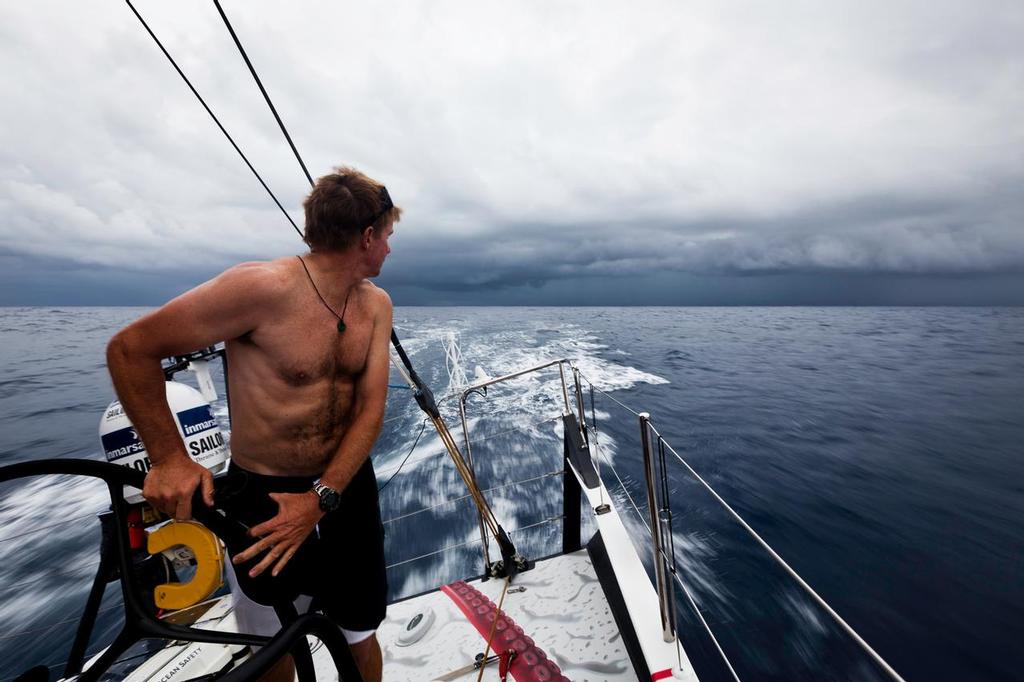 Ken Read looks back at some weather forming near the exit of the Doldrums. Puma Ocean Racing during leg 1 of the Volvo Ocean Race 2011-12, from Alicante, Spain to Cape Town, South Africa. (Credit: Amory Ross/PUMA Ocean Racing/Volvo Ocean Race) © Volvo Ocean Race http://www.volvooceanrace.com