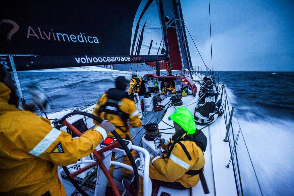 August 14, 2014. Round Britain Island Race Day 4 - OBR content Team Alvimedica: Alberto Bolzan drinks from his water bottle at the helm of Alvimedica after a sail change during the RORC's Round Britain and Ireland Race. photo copyright  Amory Ross / Team Alvimedica taken at  and featuring the  class