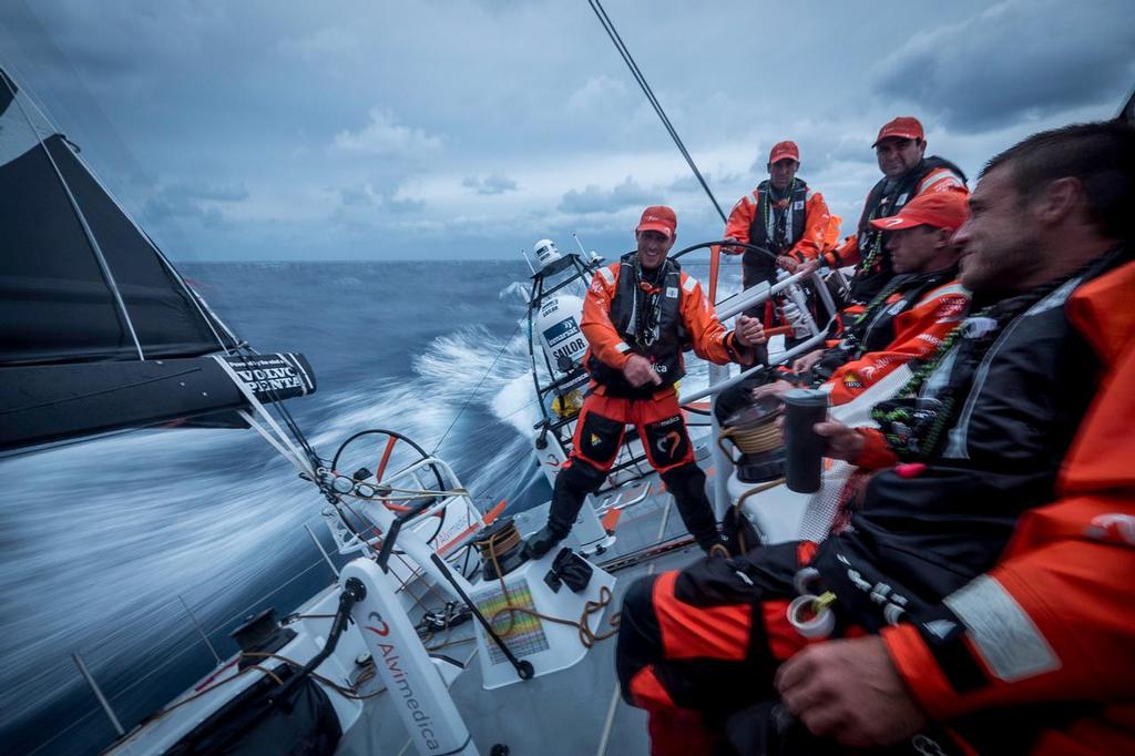 October 13, 2014. Leg 1 onboard Team Alvimedica. Day 2 brings the last miles in the Mediterranean Sea, and the first in the Atlantic Ocean, with an early morning exit through a busy Gibraltar Straits. Dave Swete and Nick Dana are in on a joke that nobody else seems to be privy to; humor is an essential part to life onboard, especially when the weather turns for the worse. ©  Amory Ross / Team Alvimedica