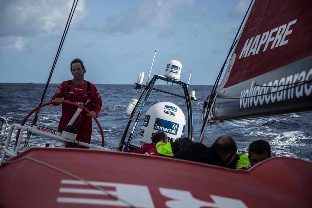 October 14, 2014. Iker Martinez on the helm while Mapfre's crew is hoisting on of the heavy sails © Volvo Ocean Race - Team Campos - Francisco Vignale http://www.volvooceanrace.com/