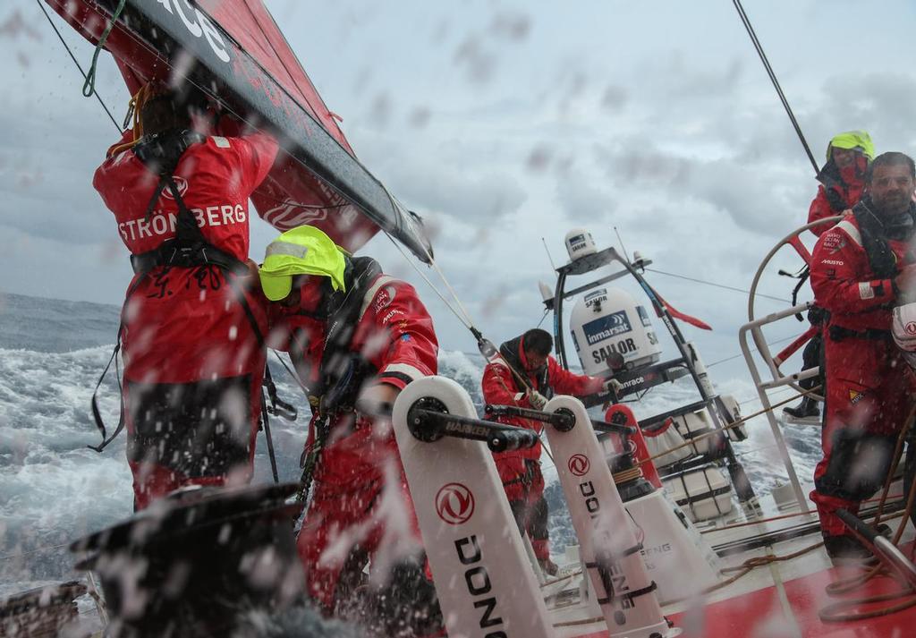 October 13, 2014. Leg 1 onboard Dongfeng Race Team, taking a reef just before the night as the wind is increasing © Yann Riou / Dongfeng Race Team