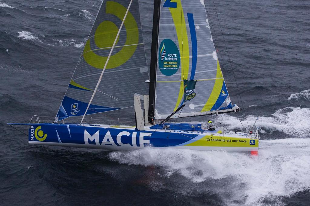 Route du Rhum - Aerial view of the IMOCA MACIF with french skipper Francois Gabart training in bad weather off Groix Island, south brittany, prior to the Route du Rhum Destination Guadeloupe on October 06, 2014. photo copyright  JM Liot / DPPI / MACIF taken at  and featuring the  class