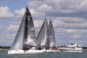 Close finish of race 7 Jeez Louise, Jelvis, Xcentric Ripper 2014 J111 World Championship Cowes Isle of Wight England. 22 August 2014 Race 5,6 & 7 photo copyright Stuart Johnstone taken at  and featuring the  class