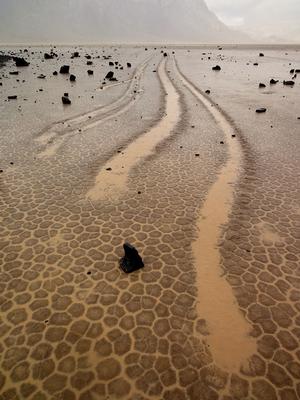 Parallel trails carved in the wet, mud-cracked surface of the playa. photo copyright Jim Norris taken at  and featuring the  class