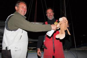Swish's mascot takes a sip of Lanson too! L-R: Paul Pegg, Nick Legatt and Monkey - Sevenstar Round Britain and Ireland Race 2014 photo copyright Patrick Eden/RORC taken at  and featuring the  class