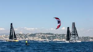 Foiling kiteboarder takes on the mighty GC32s. - GC 32 The Great Cup Marseille One Design 2014 photo copyright Sander van der Borch/The Great Cup taken at  and featuring the  class