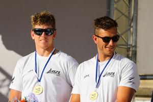 Burling and Tuke NZL, on the podium - 2014 ISAF Sailing World Championships Santander photo copyright ISAF  taken at  and featuring the  class