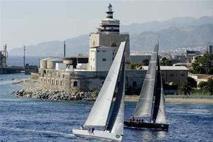 2014 Rolex Middle Sea Race - CANTANKEROUS (ITA) and BLACK PEARL (ITA) rounding the San Rainieri lighthouse at the Strait of Messina. photo copyright  Rolex/ Kurt Arrigo http://www.regattanews.com taken at  and featuring the  class