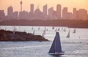 Wild Oats XI leads the fleet out of the harbour at sunset. photo copyright Crosbie Lorimer http://www.crosbielorimer.com taken at  and featuring the  class