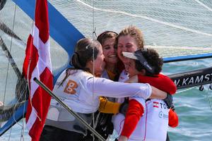 Gold and silver 49erFX embrace - 2014 ISAF Sailing World Championships Santander photo copyright ISAF  taken at  and featuring the  class