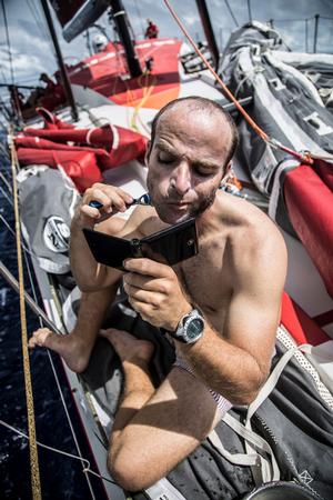 October 21, 2014. Leg 1 onboard MAPFRE. Nicholas Lunven fitting in a shave between watches.  Volvo Ocean Race photo copyright Francisco Vignale/Mapfre/Volvo Ocean Race taken at  and featuring the  class