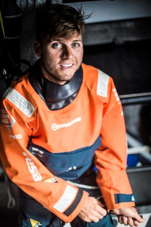 October 24, 2014. Onboard Team Vestas Wind. Tom Johnson, the youngest and happiest crew member, on Day 16 photo copyright Brian Carlin - Team Vestas Wind taken at  and featuring the  class