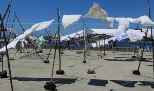 The clothes lines in Afurada - 2014 European Odyssey photo copyright Cornell Sailing Events taken at  and featuring the  class