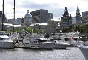 Yacht CLub Montreal on the eastern end of the Old Port - Overlooking the harbour is 'The Sailor's Church', Notre Dame Chapel with 'Our lady of the Harbour statue atop it's dome - Une Offre Que Vous Ne Pouvez Pas Refuser photo copyright The Galley Guys taken at  and featuring the  class
