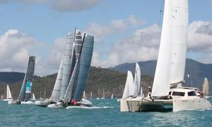 Multihull Racing fleet was led Apc mad max start line finish on day three - Vision Surveys 25th Airlie Beach Race Week 2014 photo copyright Airlie Beach Race Week media taken at  and featuring the  class