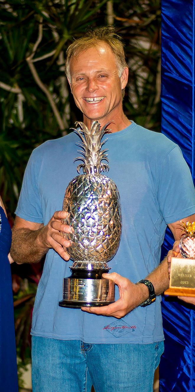 Shockwave’s Reggie Cole accepts the top prize for the Pineapple Cup – Montego Bay Race in 2013.  © sukimacphoto.com