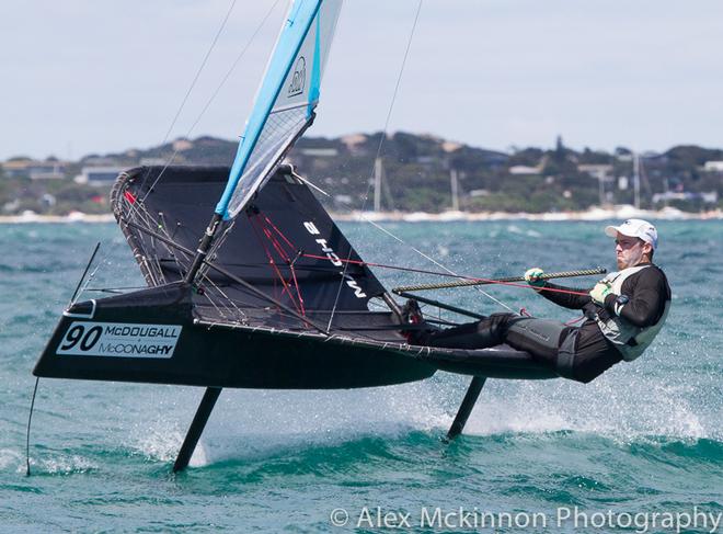AUS3977 - Local sailor, Harry Mighell, hard at work piloting the Moth at speed. - 2015 Moth World Championships ©  Alex McKinnon Photography http://www.alexmckinnonphotography.com