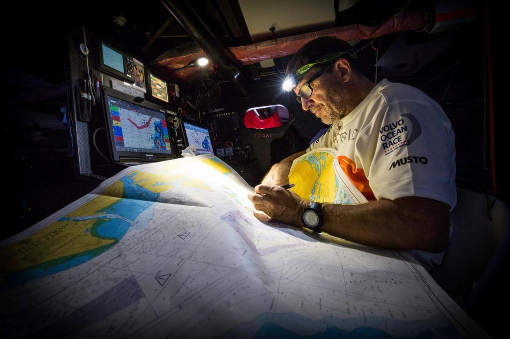 January 16, 2015. Leg 3 onboard Team Alvimedica. Day 13. After a day of becalmed drifting in the Bay of Bengal, a light wind fills from the north--a welcome change but unfortunate in that the rest of the fleet was first to it. Navigator Will Oxley begins the laborious task of research for the Malacca Strait passage to a crowded Singapore. photo copyright  Amory Ross / Team Alvimedica taken at  and featuring the  class