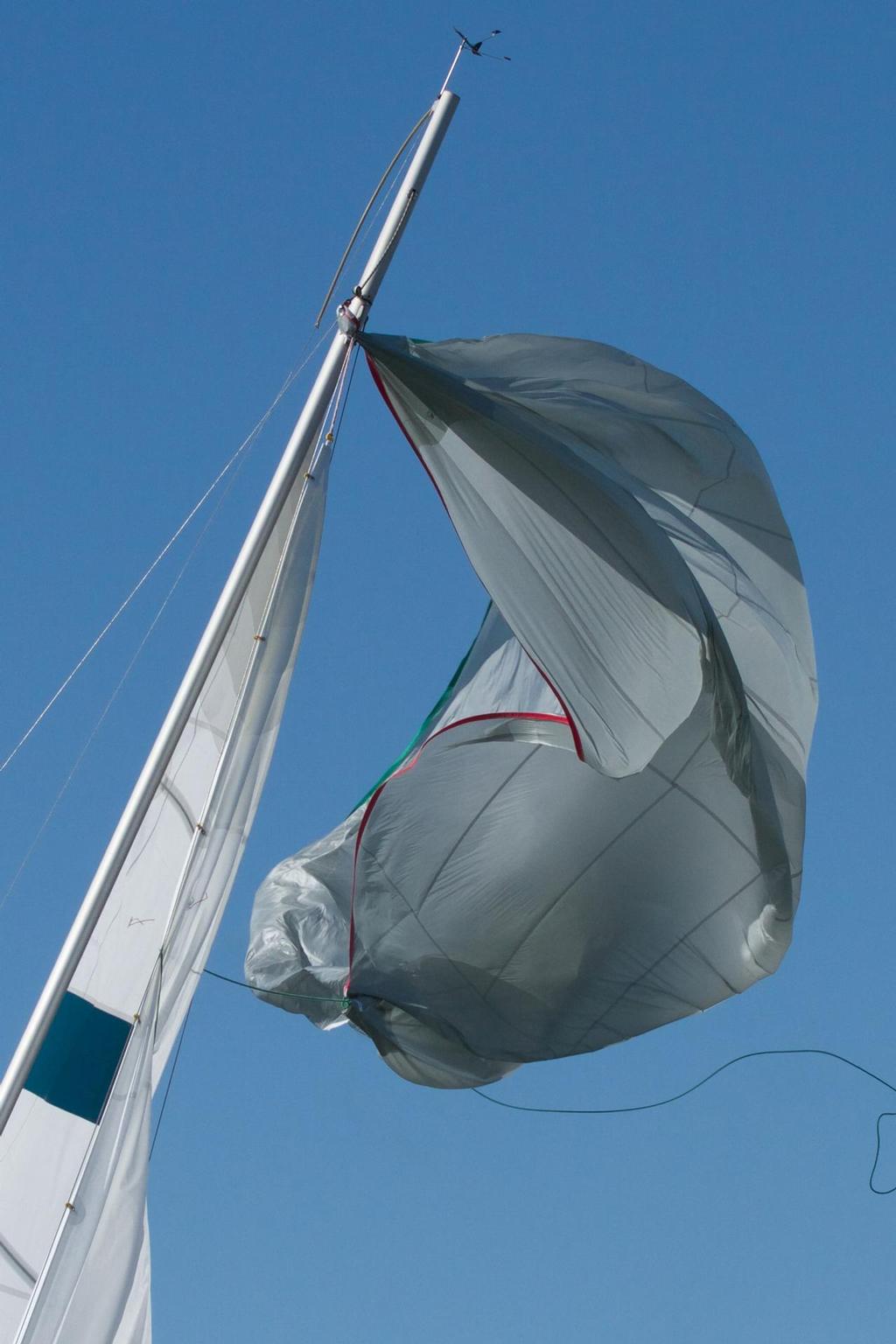 The spinnaker, battered, torn and bruised.  Amazingly the rig remained intact. © Bernie Kaaks