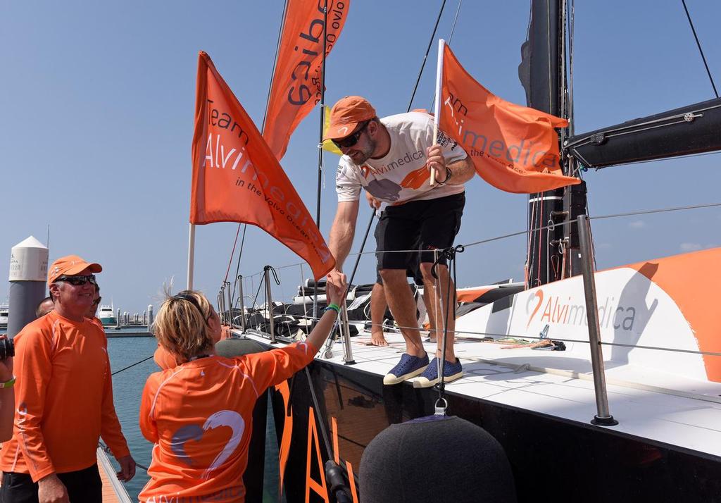 January 27, 2015. Team Alvimedica arrives in Sanya in third position, after 23 days of sailing. Ryan Houston greets the family and the shore crew at the pontoon. © Rick Tomlinson/Volvo Ocean Race http://www.volvooceanrace.com