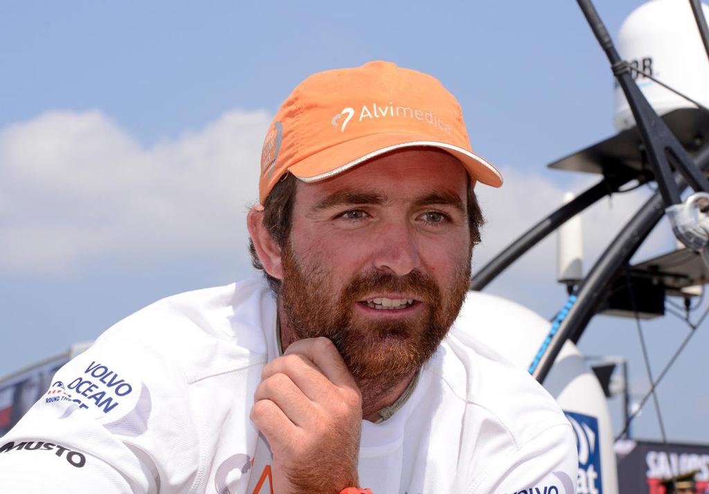 January 27, 2015. Team Alvimedica arrives in Sanya in third position, after 23 days of sailing. Skipper Charlie Enright is interviewed at the dock. © Rick Tomlinson/Volvo Ocean Race http://www.volvooceanrace.com