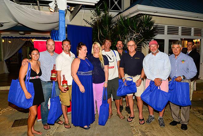 Representatives from the “MoBay” fleet pose with their participation gifts (with race Coordinator, Evelyn Harrington, fourth from left). © Nigel Lord