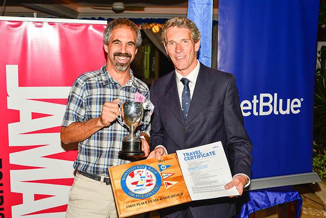 Brian Harris of Amhas accepts Class 40 first-place prizes from Montego Bay Yacht Club Commodore Nigel Knowles © Nigel Lord
