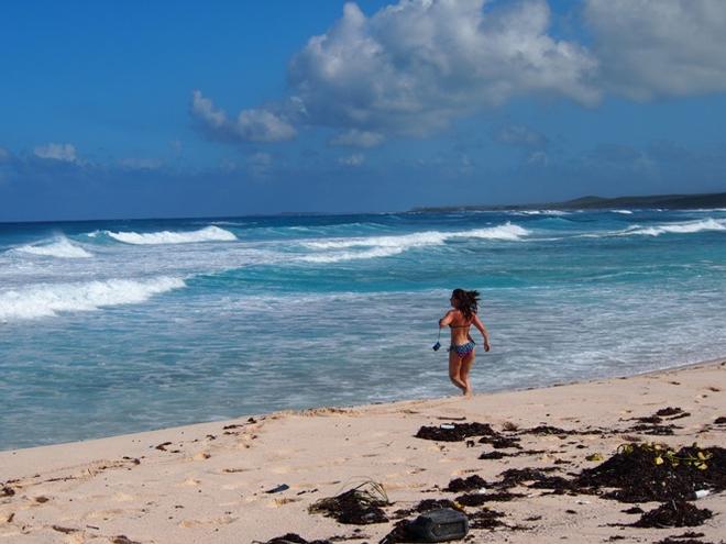 Running headfirst into the waves at surfer’s beach. - Eleuthera, Bahamas - A tiny chain of islands © Clarity Nicoll