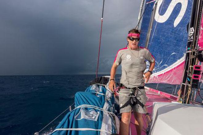 Team SCA's Stacey Jackson works the bow as the team prepare for an approaching squall. © Corinna Halloran / Team SCA