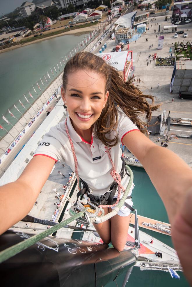 February 05, 2015. Rolene Strauss, Miss World 2014, at the top of the Dongfeng Race Team mast in the Volvo Ocean Race Village in Sanya. © Rolene Strauss