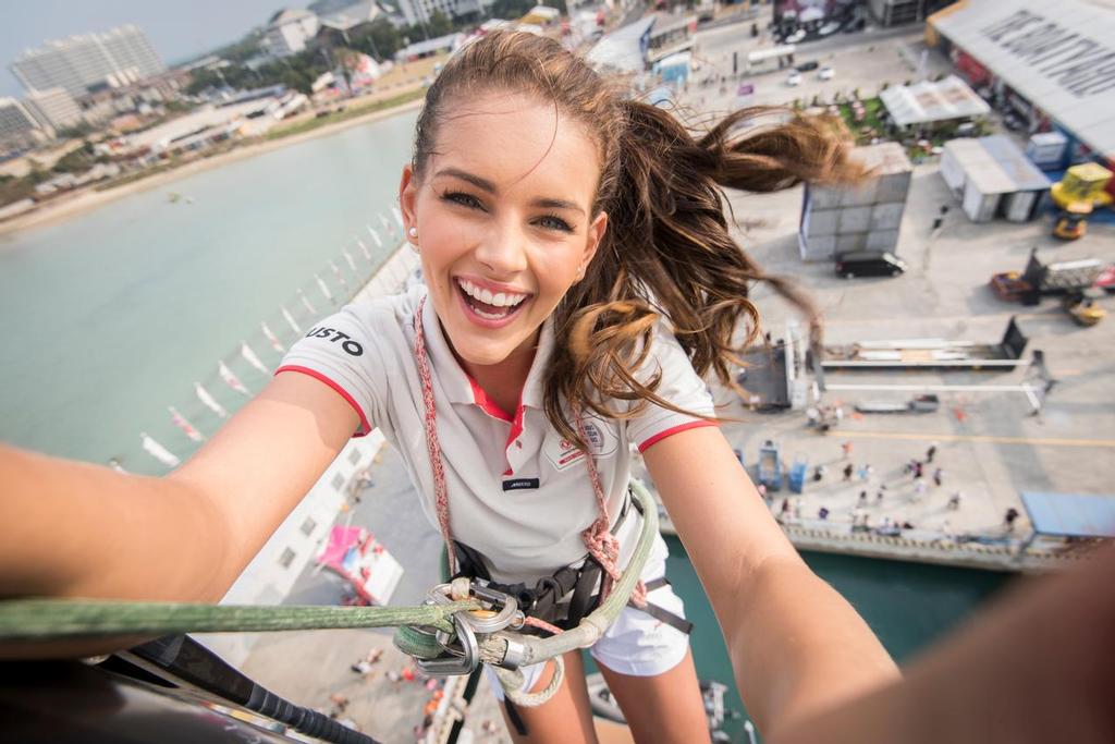 February 05, 2015. Rolene Strauss, Miss World 2014, at the top of the Dongfeng Race Team mast in the Volvo Ocean Race Village in Sanya. © Rolene Strauss
