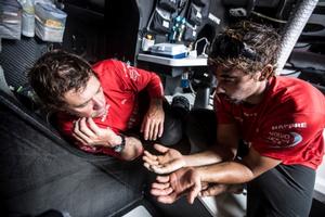 Doctor Antonio Cuervas-Mons 'Neti' comparing Willy Altadils hands to see the improvements - Volvo Ocean Race 2014-15 photo copyright Francisco Vignale/Mapfre/Volvo Ocean Race taken at  and featuring the  class