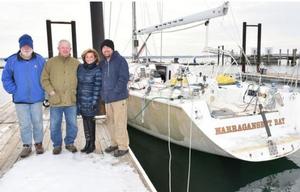Len and Jill Hubbard of Jamestown, center, stand Saturday with Reg and Jason McGlashan of Australia next to Sedona at Conanicut Marina in Jamestown - The Newport Daily News photo copyright Dave Hansen taken at  and featuring the  class