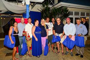 Representatives from the “MoBay” fleet pose with their participation gifts (with race Coordinator, Evelyn Harrington, fourth from left). photo copyright Nigel Lord taken at  and featuring the  class