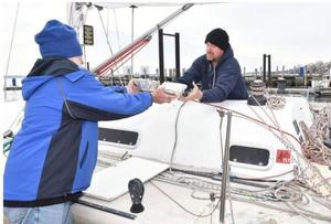 Reg, left, and Jason McGlashan load food aboard Sedona on Saturday at Conanicut Marina in Jamestown. The father and son plan to sail the boat home to Australia - The Newport Daily News photo copyright Dave Hansen taken at  and featuring the  class