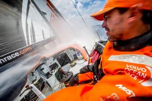 Team Alvimedica - Out of the doldrums,the pace quickens for the fleet on the race south to a light-wind trough of low pressure and the Vanuatu wind shadow. Alberto Bolzan turns from the incoming wave - Volvo Ocean Race 2014-15 photo copyright  Amory Ross / Team Alvimedica taken at  and featuring the  class