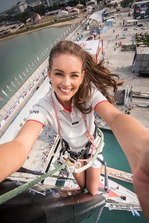 February 05, 2015. Rolene Strauss, Miss World 2014, at the top of the Dongfeng Race Team mast in the Volvo Ocean Race Village in Sanya. photo copyright Rolene Strauss taken at  and featuring the  class