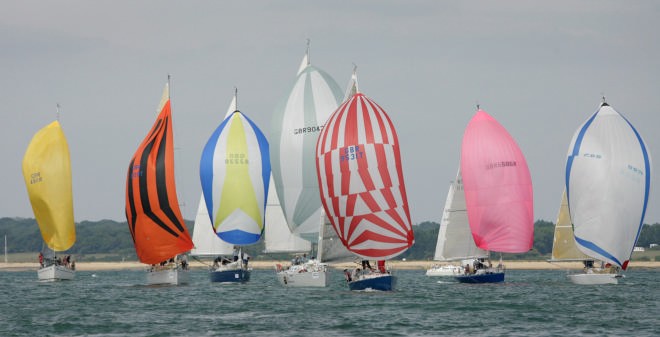 Class 4 IRC race under spinnakers during light airs racing today at Skandia Cowes Week.<br />
 © onEdition http://www.onEdition.com