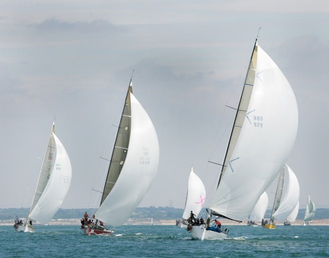 Class 1 IRC race under spinnakers during light airs racing today at Skandia Cowes Week.<br />
 © onEdition http://www.onEdition.com