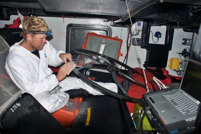 Casey Smith repairing a broken steering wheel onboard PUMA Ocean Racing, on leg 5 of the Volvo Ocean Race, from Qingdao to Rio de Janeiro © Rick Deppe/PUMA Ocean Racing/Volvo Ocean Race http://www.volvooceanrace.org