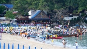 Crews arrive on Kata Beach to be transported via longtail boat, to their yachts for the day&rsquo;s racing photo copyright Sail-World.com /AUS http://www.sail-world.com taken at  and featuring the  class