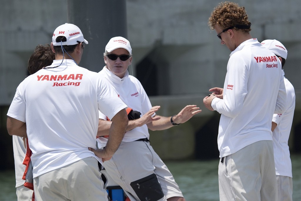 Peter Gilmour in discussion with his crew after losing three races on the final morning of the round robin. Korea Match Cup 2009, Gyeonggi-do, Korea. 5 June 2009. photo copyright Gareth Cooke - Subzero Images http://www.subzeroimages.com taken at  and featuring the  class