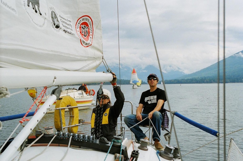 Skipper David Oosthuizen and Chantale Dery lead a fleet of 11 sailboats down the West Arm of Kootenay Lake.  - Kootenay Lake Grain Sailing photo copyright Jon Steinman taken at  and featuring the  class