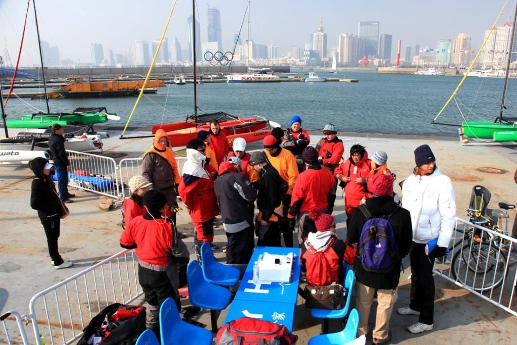 A quick briefing in the cold Qingdao Autumn - Qingdao Weta Sailing - 2009 Autumn Regatta photo copyright SailWeta Jeppe Mortensen taken at  and featuring the  class