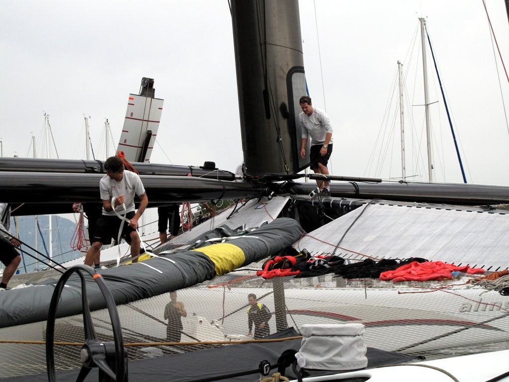 Alinghi crew prepare to drop the mast ahead of a storm photo copyright Sail-World (JPJ) www.sail-world.com taken at  and featuring the  class