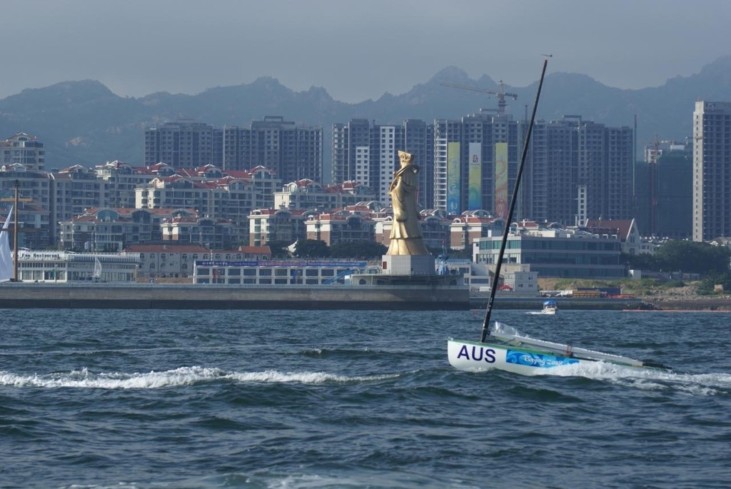 Towing past the Muzu, Qingdao photo copyright Richard Gladwell www.photosport.co.nz taken at  and featuring the  class